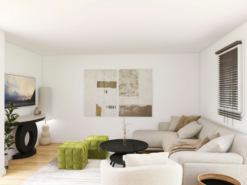 A green velvet ottoman in a living room with off-white decor.